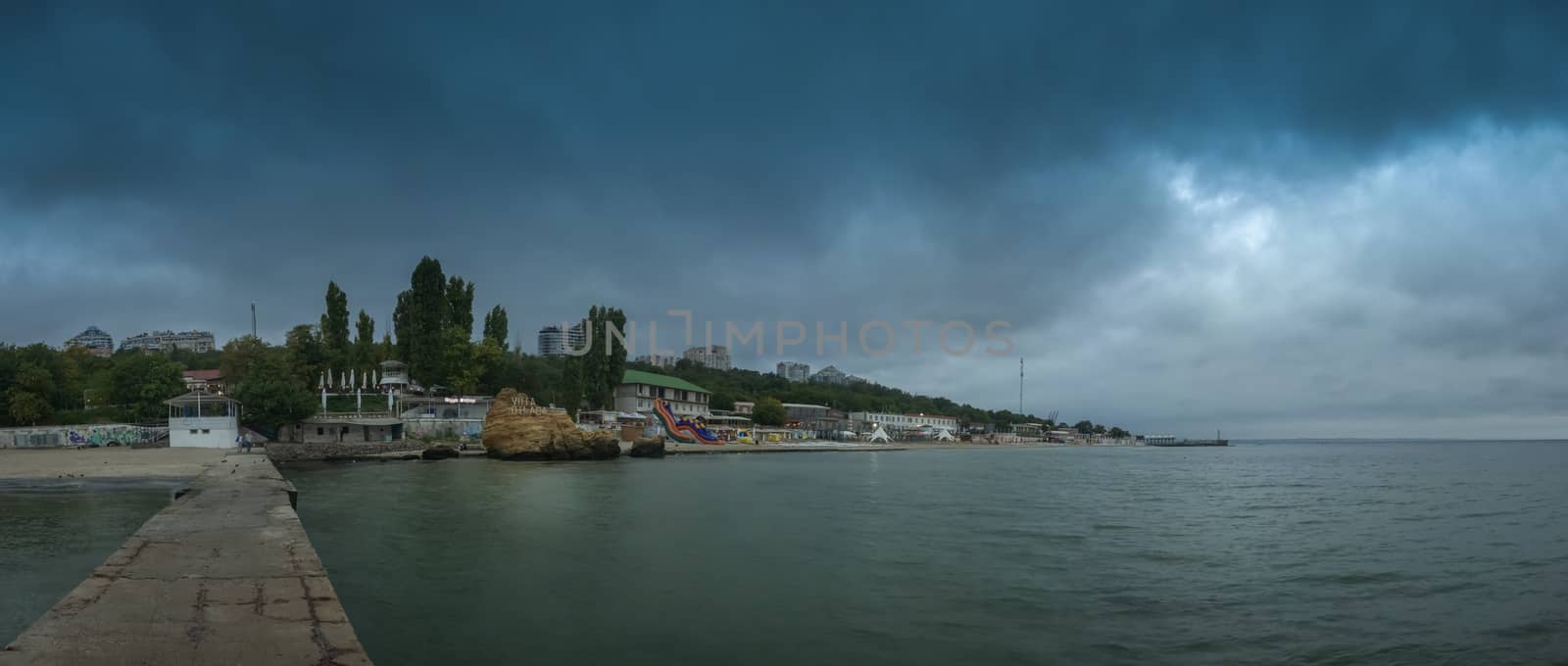 Odessa, Ukraine - 09.09.2018. Otrada beach in Odessa, Ukraine, in a gloomy summer morning. Dark clouds asperatus over the sea until dawn.