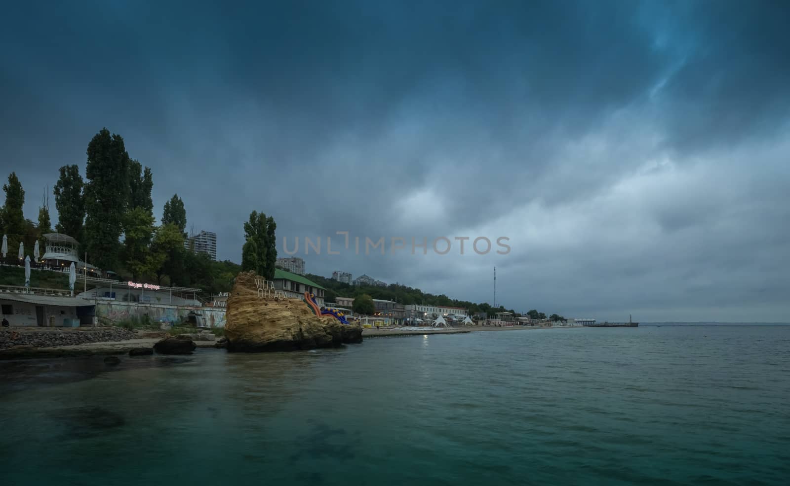 Odessa, Ukraine - 09.09.2018. Otrada beach in Odessa, Ukraine, in a gloomy summer morning. Dark clouds asperatus over the sea until dawn.