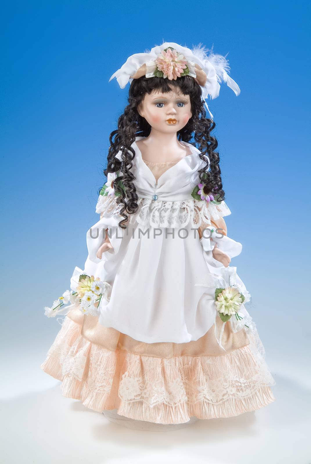 Big doll dressed in retro style on a blue and white background