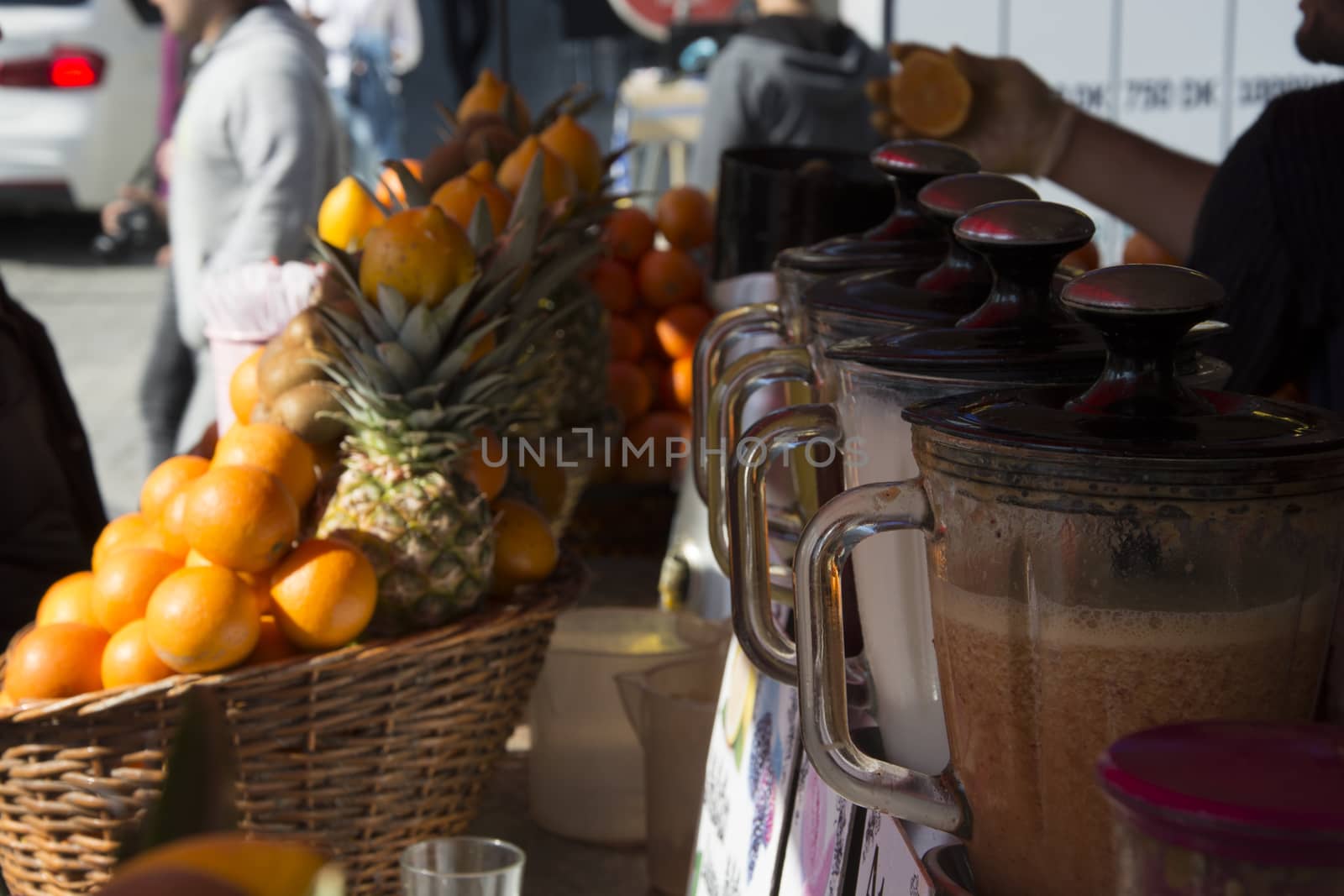 Freshly squeezed fruit juice seller. There are all kinds of fruits