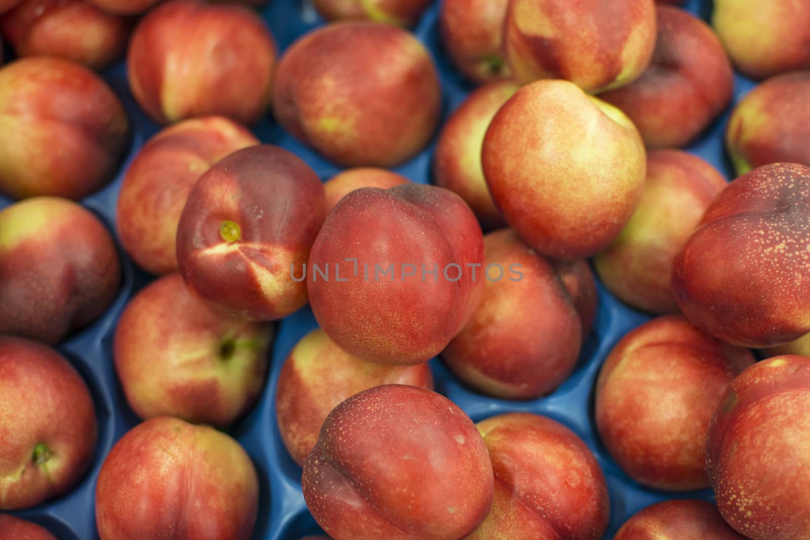 Nectarine is known as the hairless state of peach. Sold in the market. It is juicy and sweet compared to peach nectar.