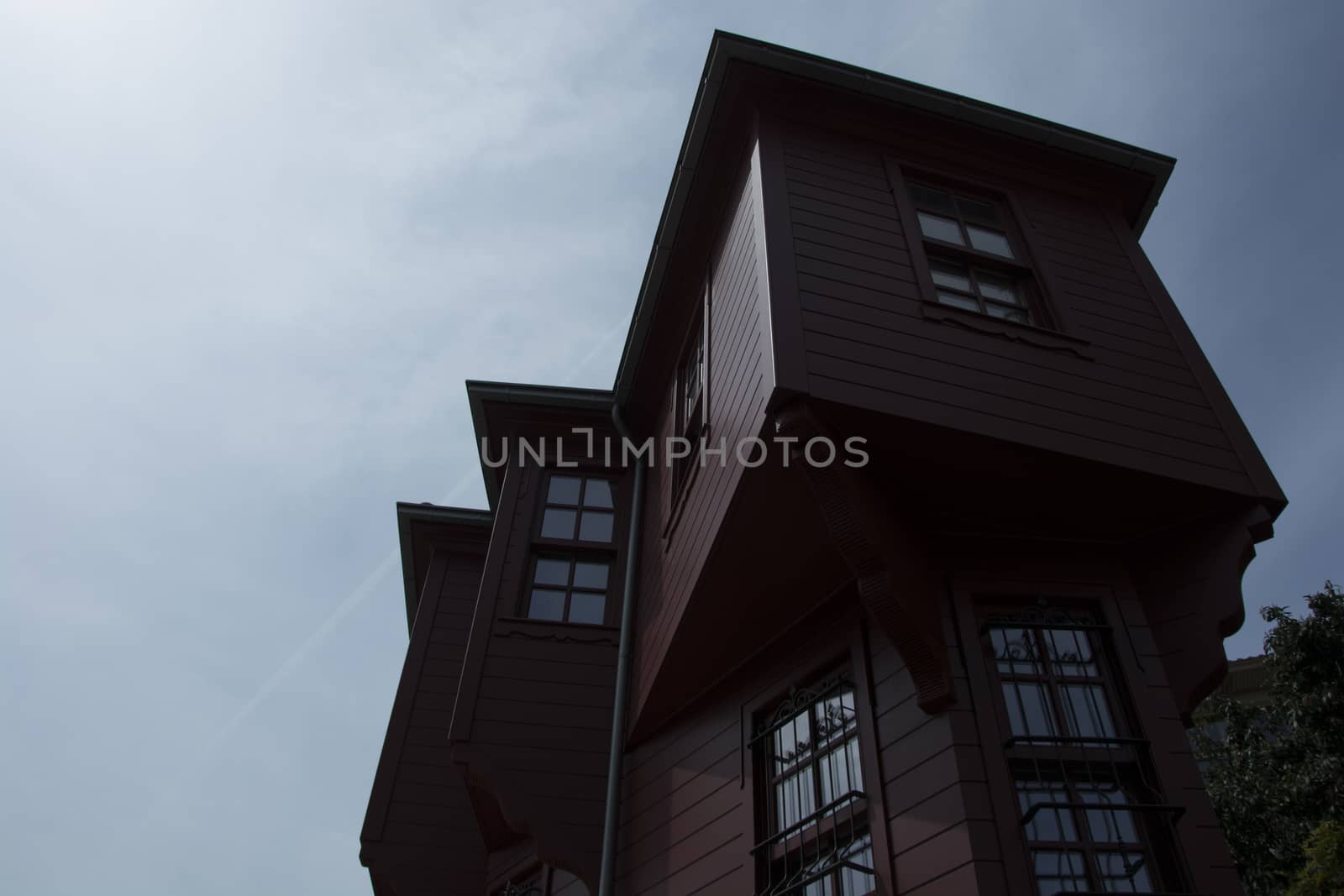 Historic wooden house with shutters. Newly restored