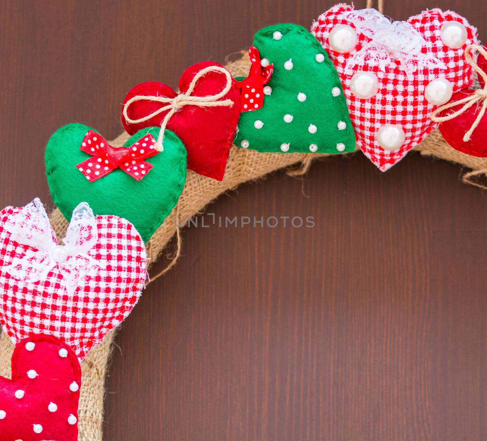 for Valentine's Day, door ornament. small, colorful heart pillows.Isolated white background Top view. Free space for your text