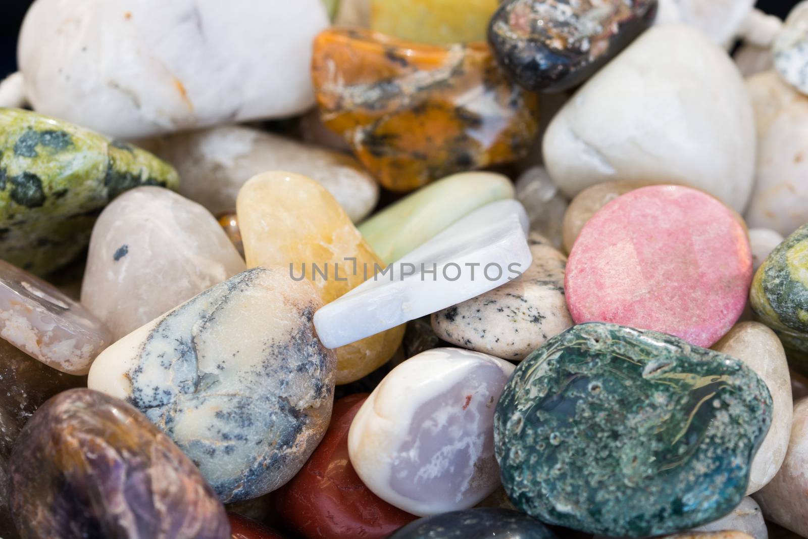 variety of natural stone. Stones in various shapes, colors and sizes. natural stone background