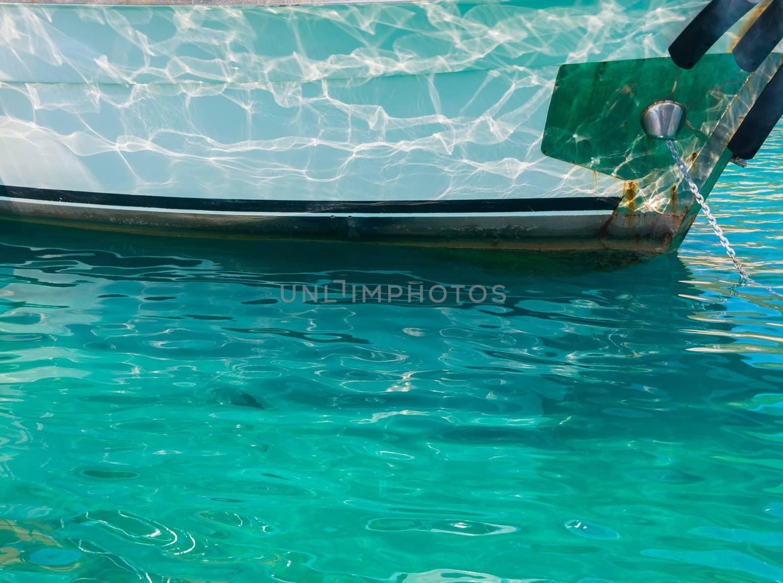 reflected in the boat. look at the sun's wave reflections