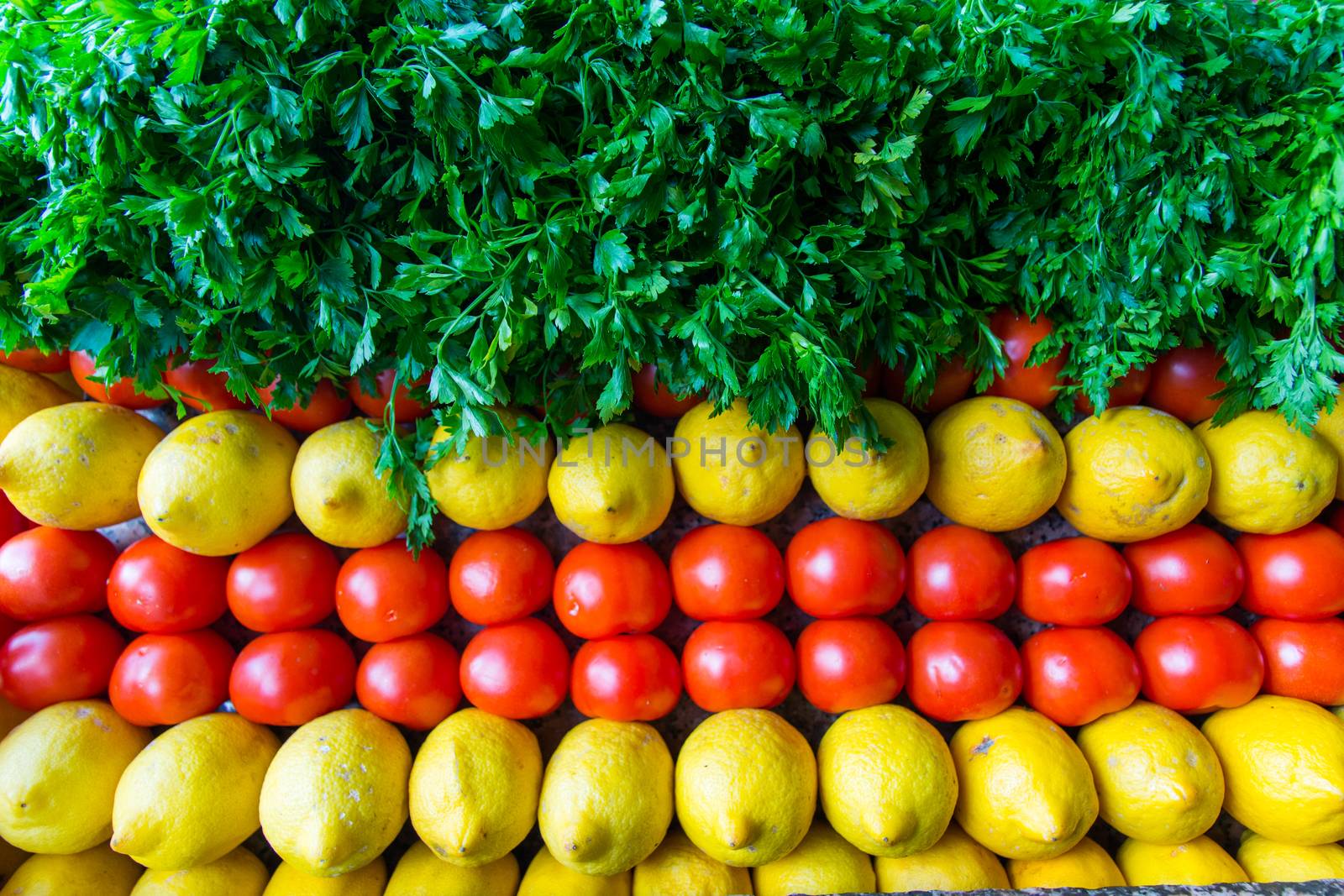 background arranged with tomatoes, lemon and parsley. vegetable and fruit framework. harvest. winter and spring. healthy nutrition background of different vegetables on table.