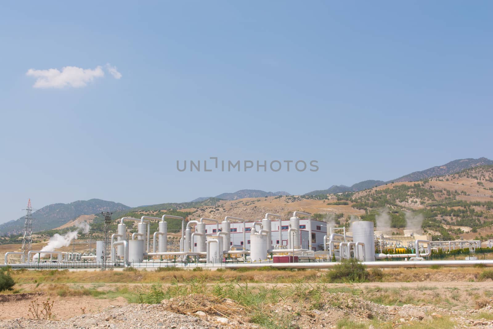 the hot water from the underground is converted to electrical energy through steam turbines.