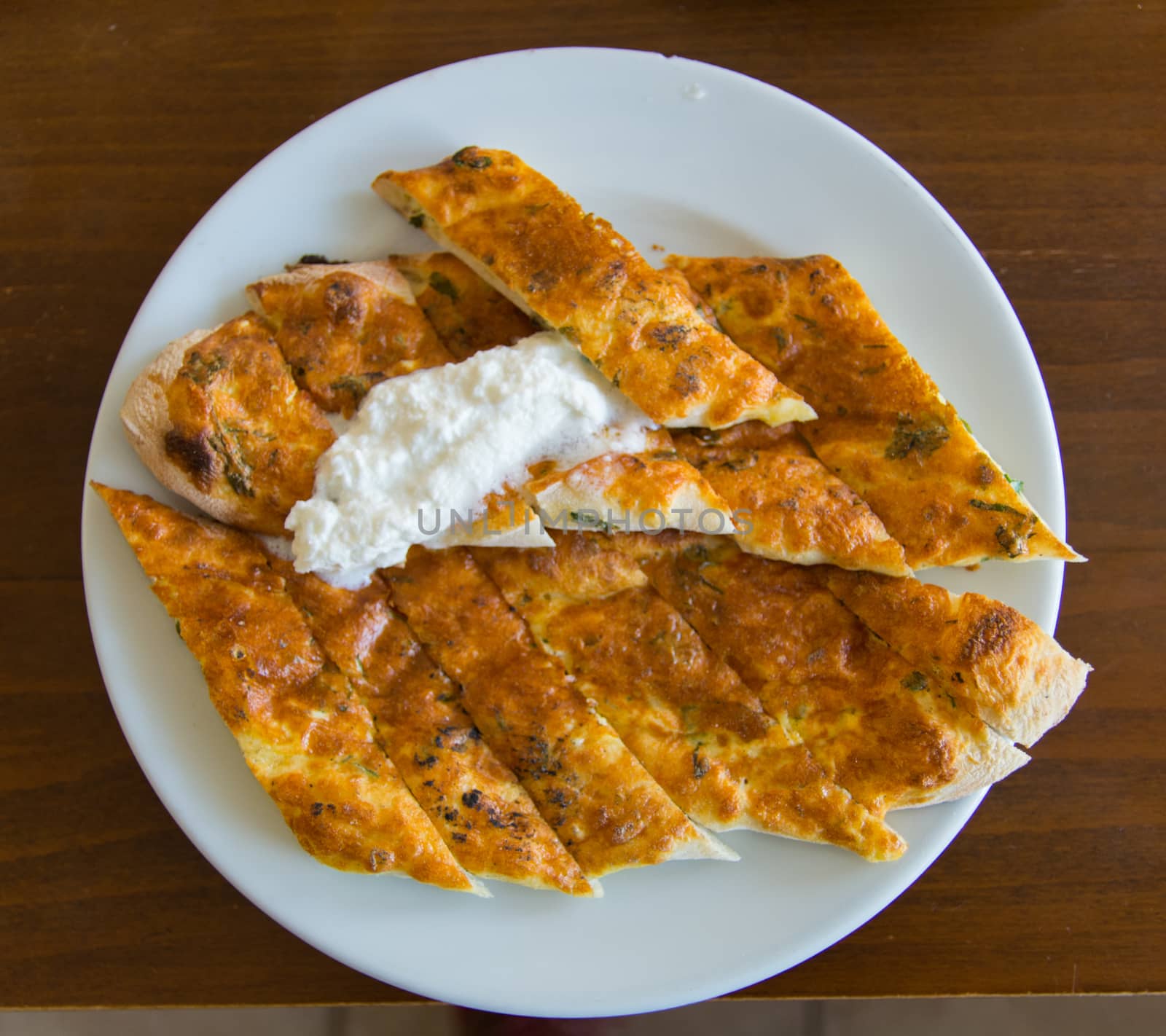 "Aydın" is made in the city "Bozdoğan". made from a mixture of cheese, egg and parsley. served with "kaymak"(cream) on top