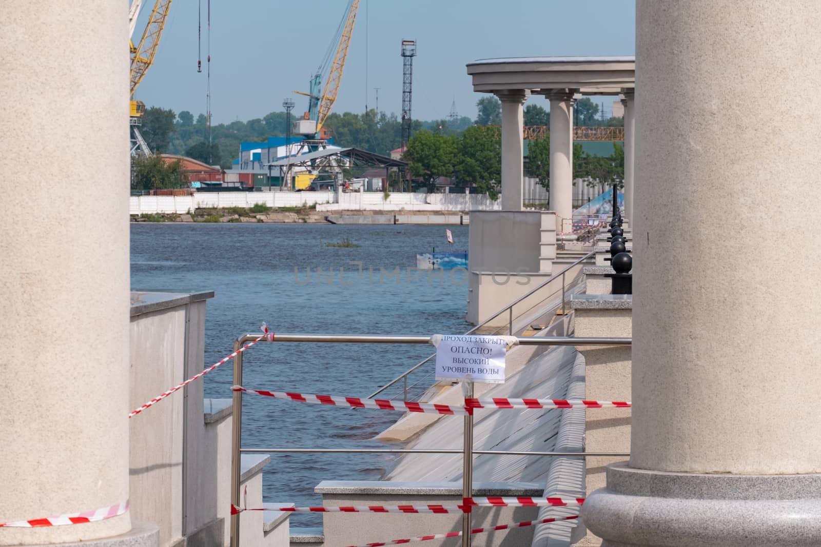 Khabarovsk, Russia - Aug 08, 2019: Flood on the Amur river near the city of Khabarovsk. The level of the Amur river at around 159 centimeters. by rdv27