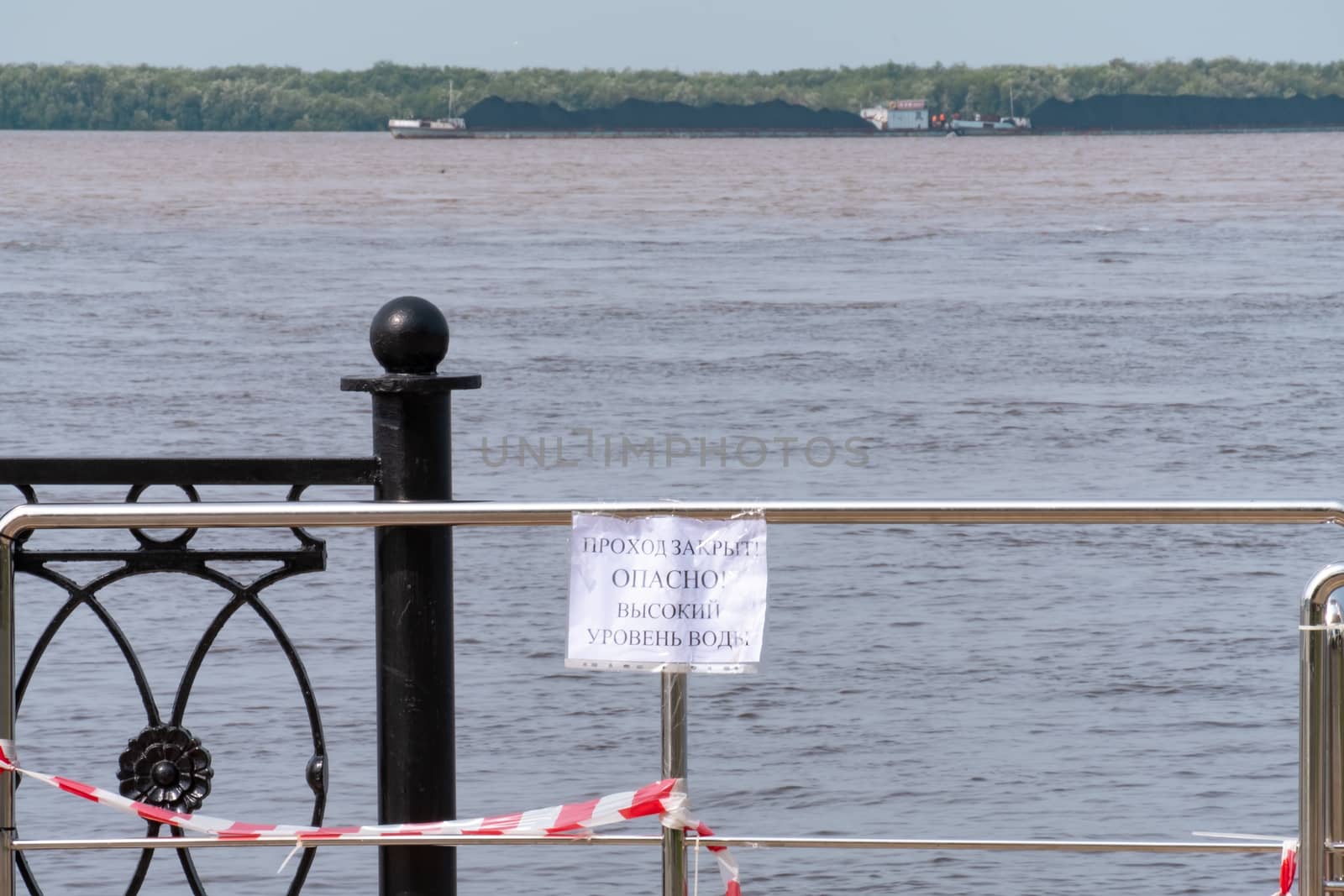 Khabarovsk, Russia - Aug 08, 2019: Flood on the Amur river near the city of Khabarovsk. The level of the Amur river at around 159 centimeters. by rdv27