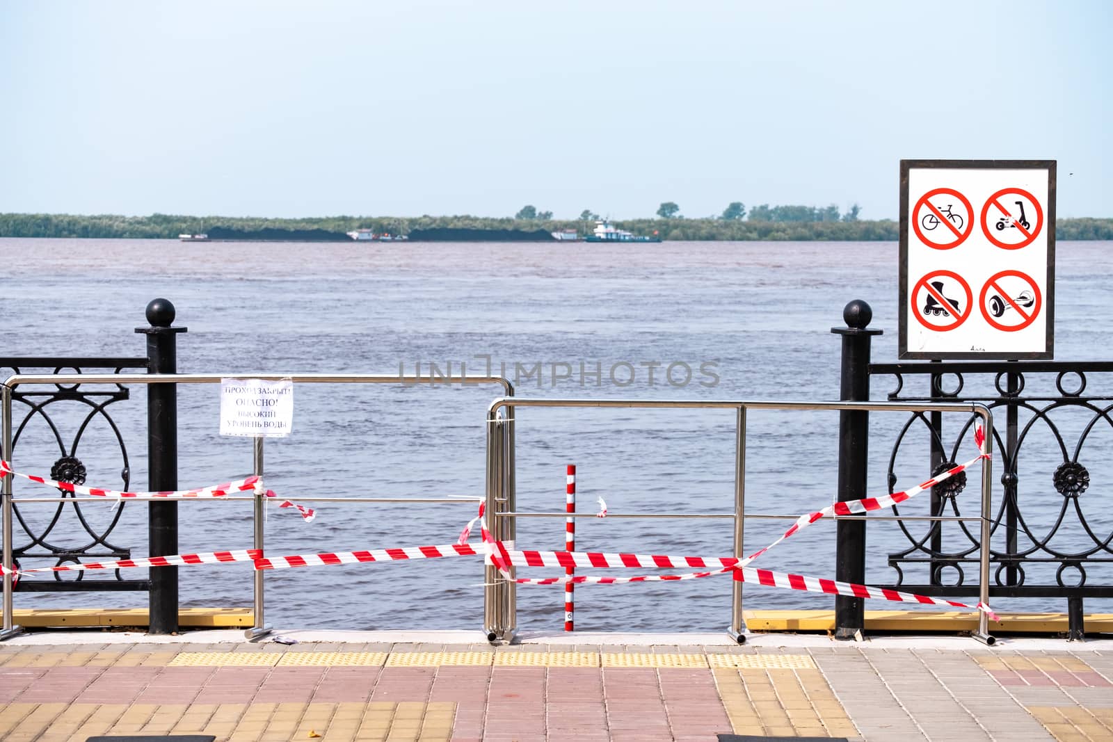 Khabarovsk, Russia - Aug 08, 2019: Flood on the Amur river near the city of Khabarovsk. The level of the Amur river at around 159 centimeters. by rdv27