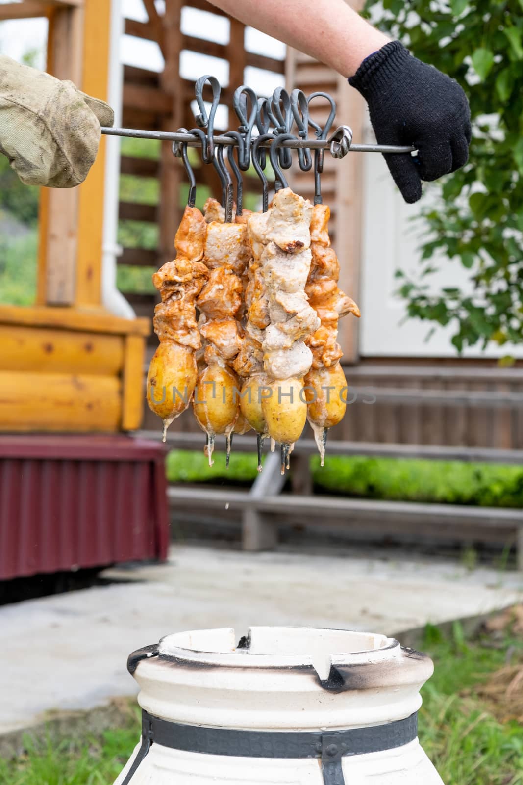 Skewers in the tandoor. Cooking kebab of meat in a tandoor