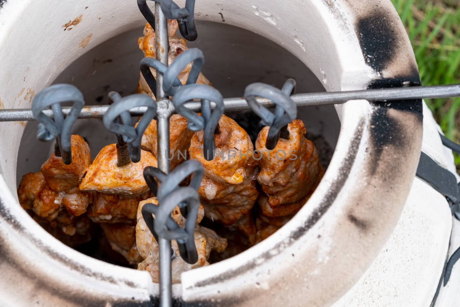 Skewers in the tandoor. Cooking kebab of meat in a tandoor