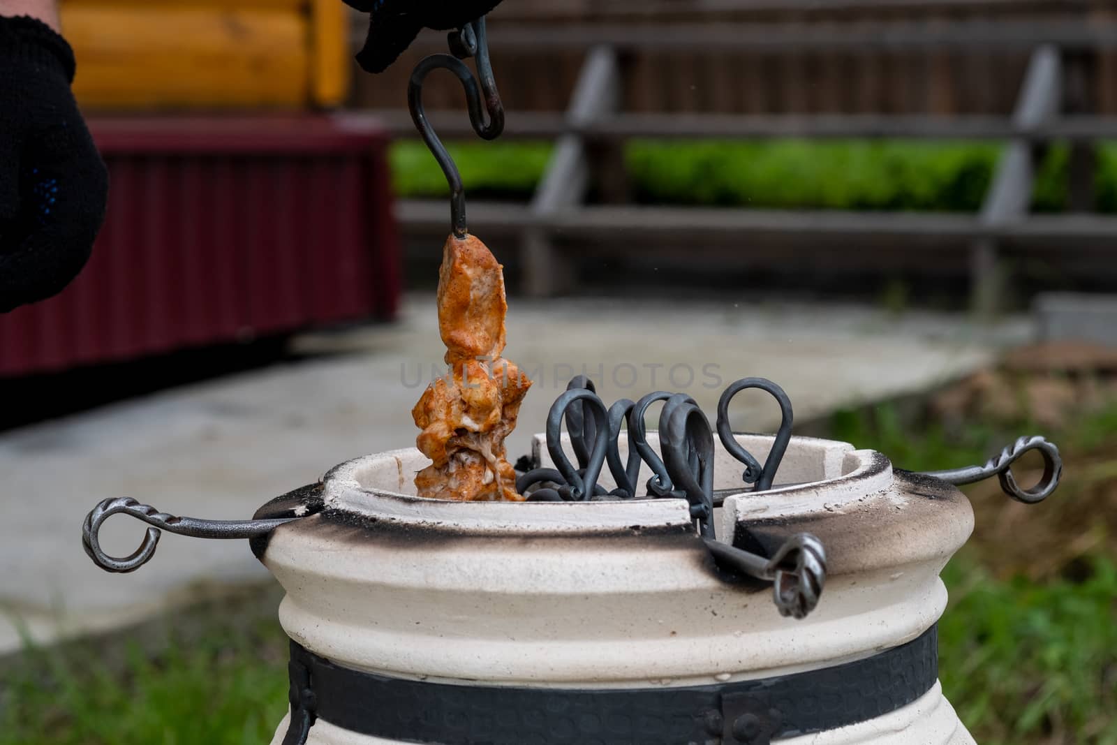 Skewers in the tandoor. Cooking kebab of meat in a tandoor