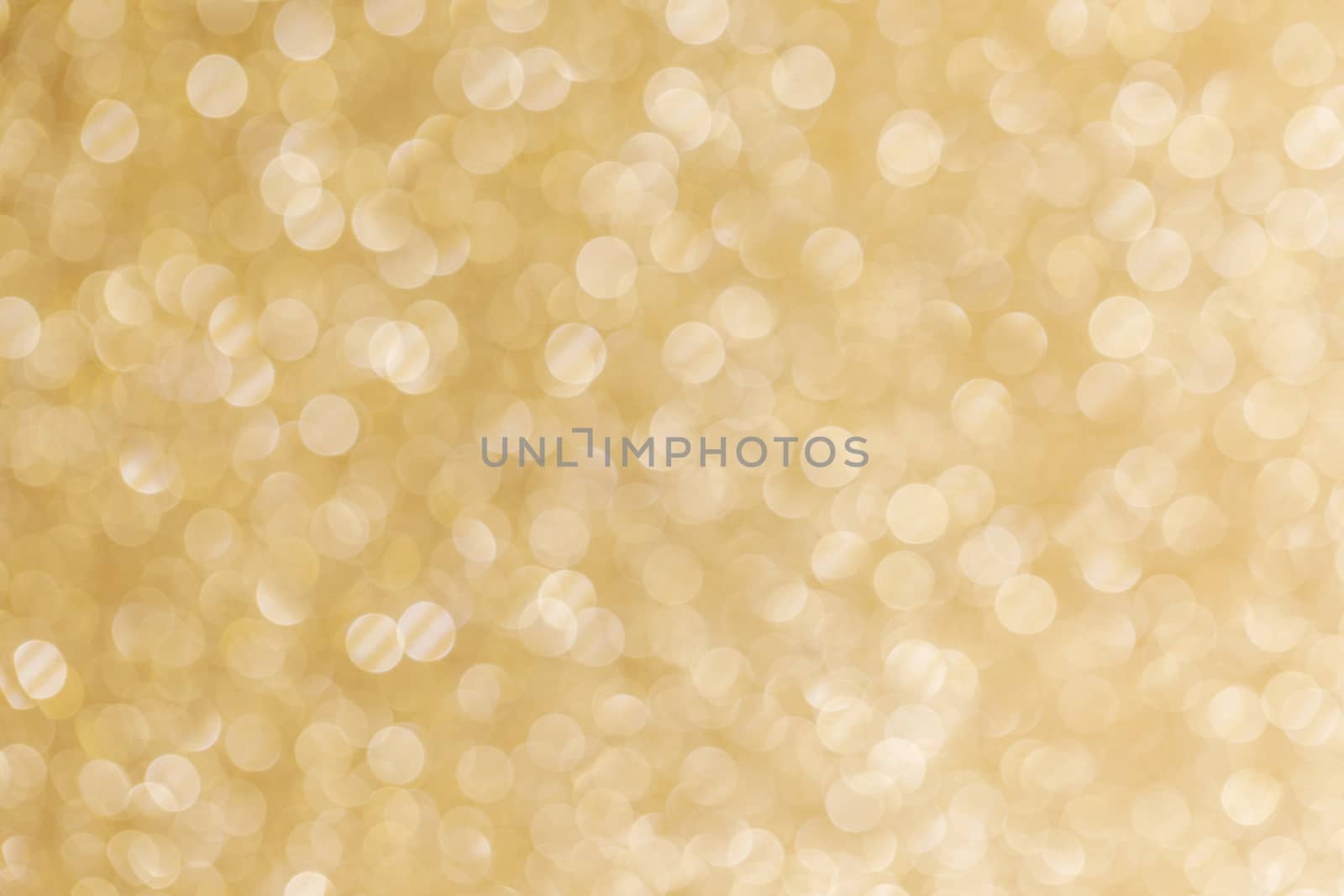 Abstract shining glitters golden holiday bokeh background with copy space for text
