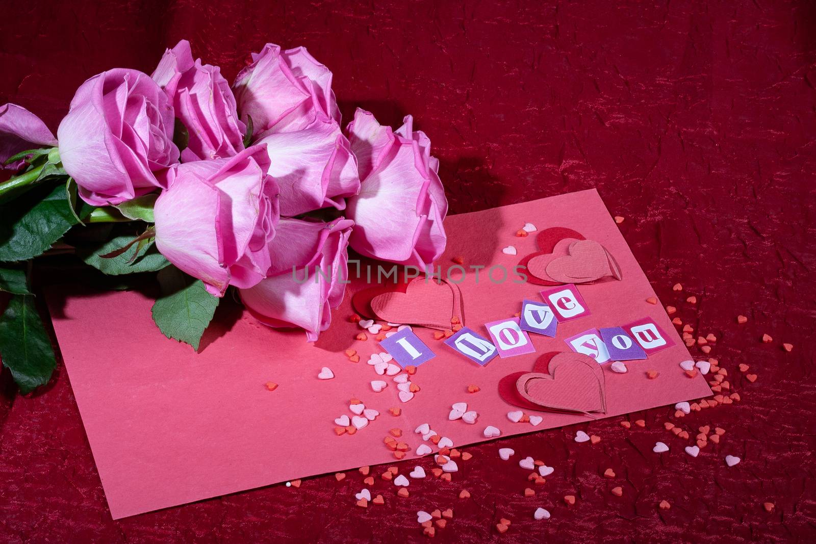 Roses and letters on a studio background