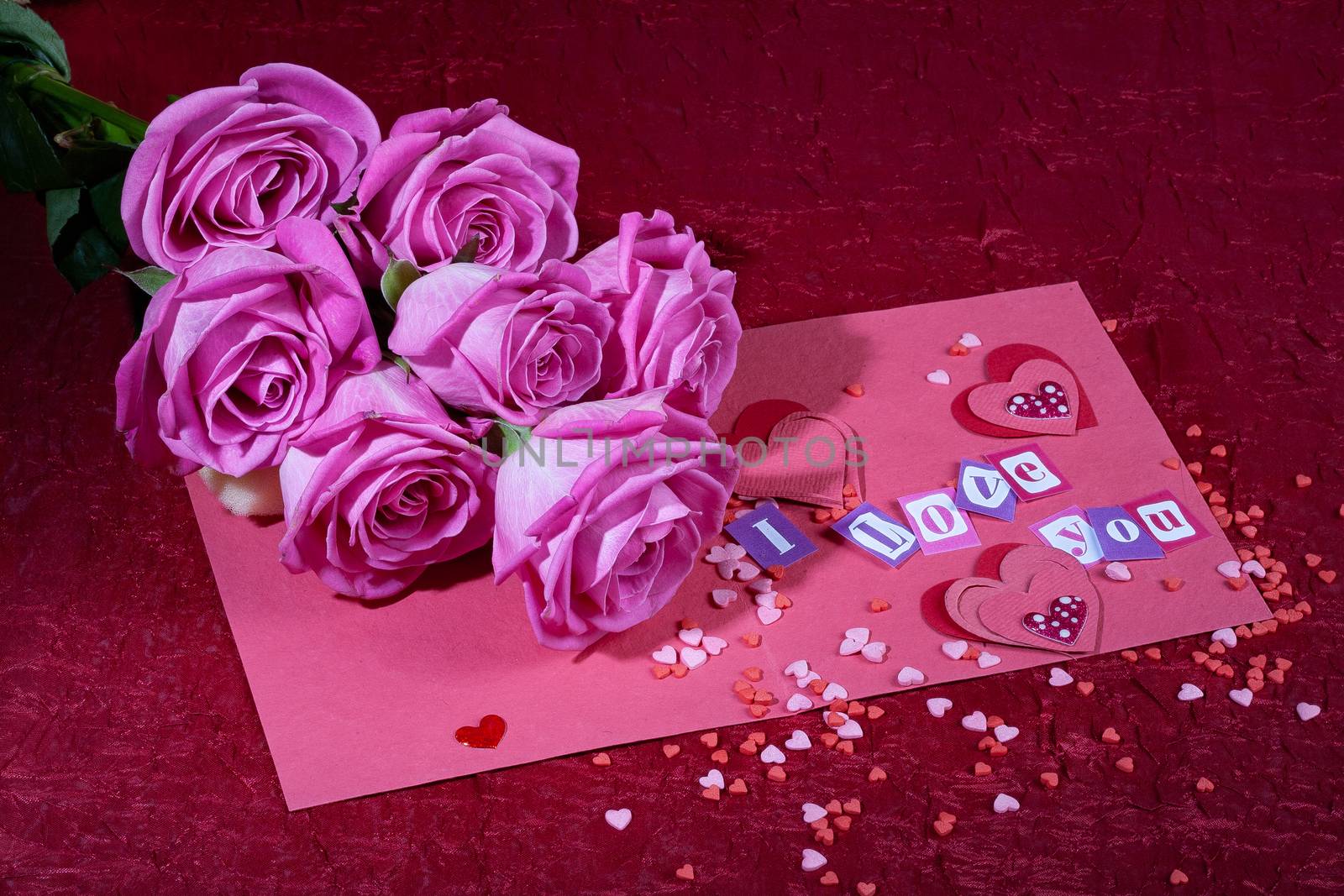 Roses and letters on a studio background