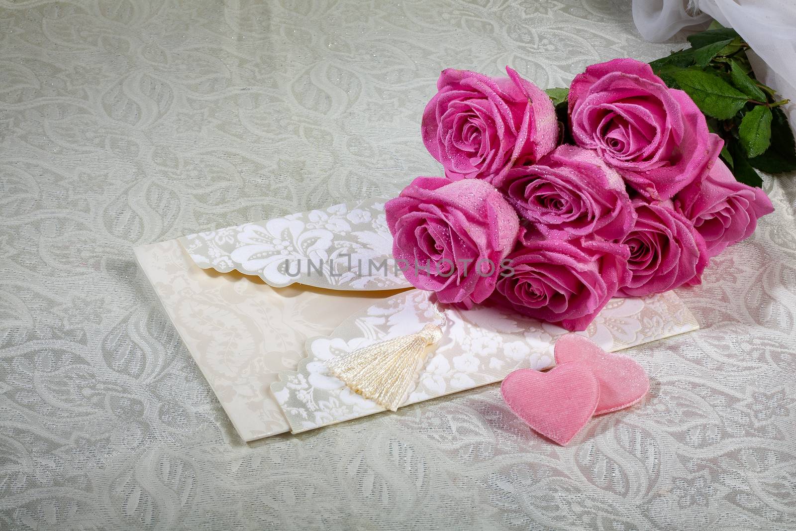 Bouquet and two hearts on a textured background