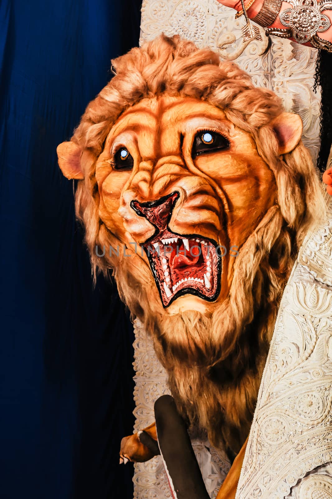 Kolkata India October 2018 - Close up portrait of Screaming horror face of King Bengal Tiger Head. Ghost cruel, Scary halloween shot in Durga Puja festival. A Lion symbolizes power to destroy evil.