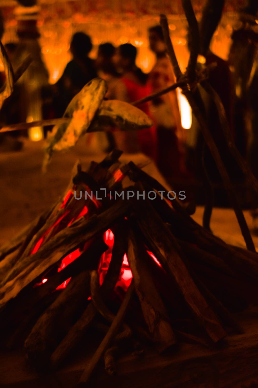 KOLKATA , INDIA SEPTEMBER 26, 2017 - Decorated art and craft decoration of artificial fireplace with flames made of wood timer and charcoal showing ancient life style in a famous Durga Puja pandal. by sudiptabhowmick