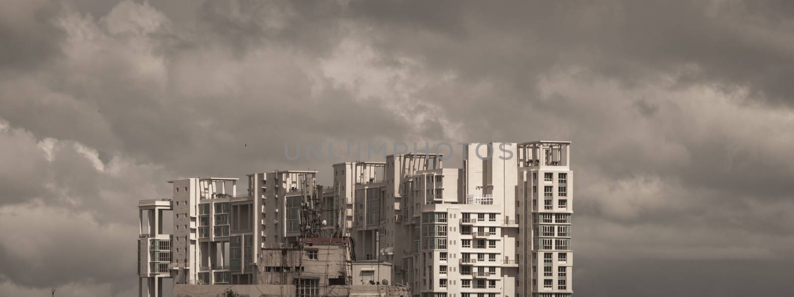 Delay Monsoon Rainy day city. Heavy Stormy rain clouds up above highrise. Storms and dark monsoons typical modern residential skyscrapers. Kolkata, Bengal India. A landscape nature Photography.