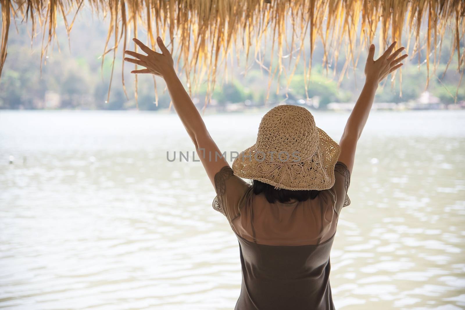 Happy lady during vacation at water site nature - happy woman vacation concept