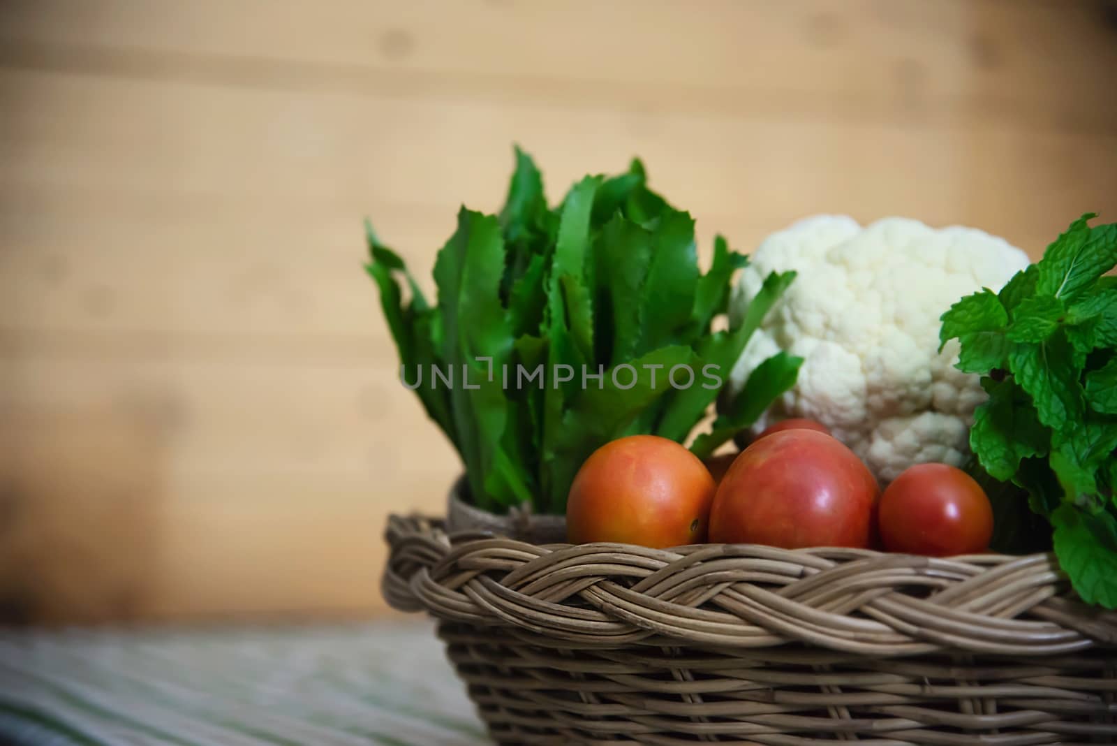 Fresh variety vegetable basket ready to be cooked in the kitchen - vegetable for making food background with copy space concept by pairhandmade