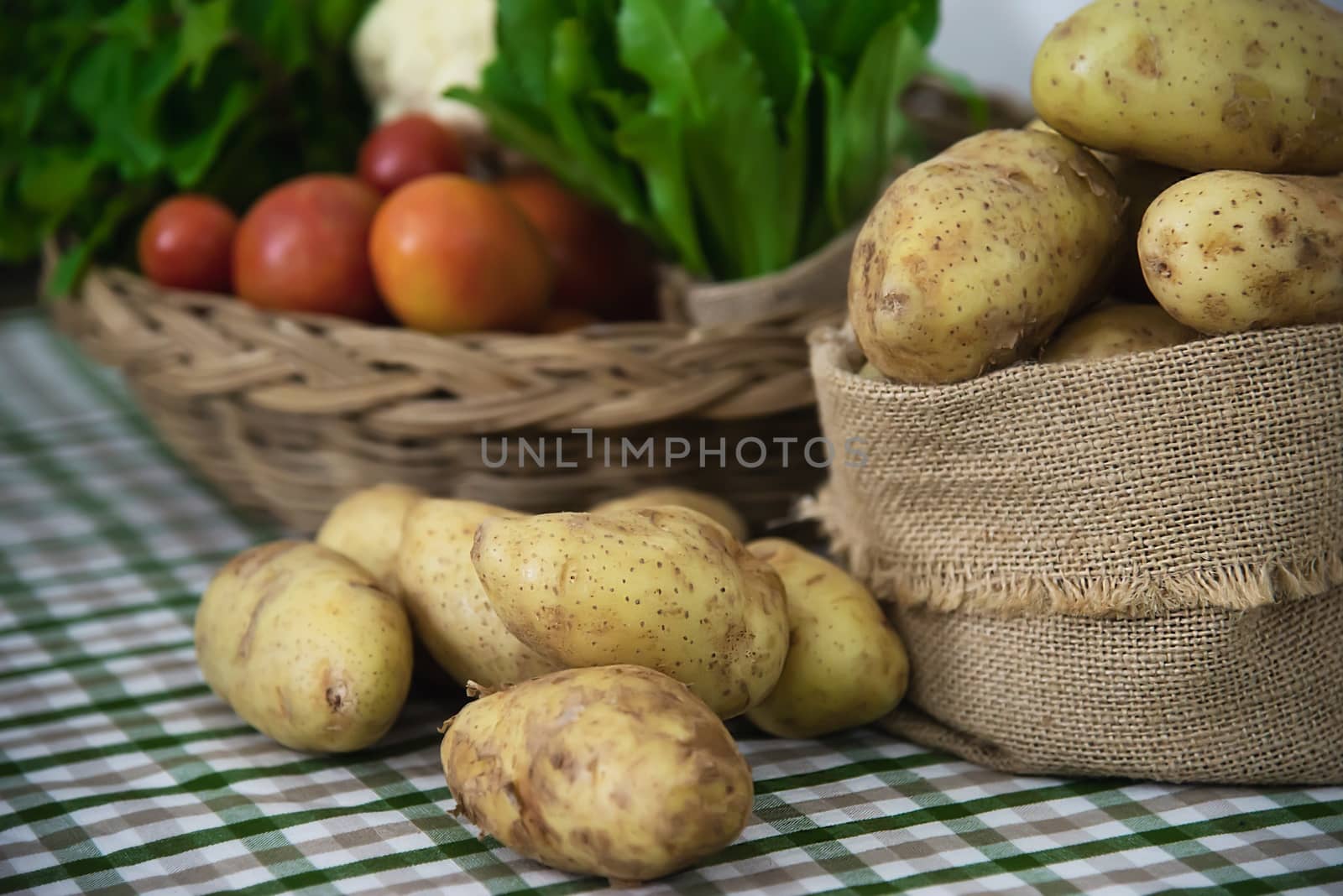 Fresh potato in kitchen ready to be cooked - fresh vegetable preparing for making food concept