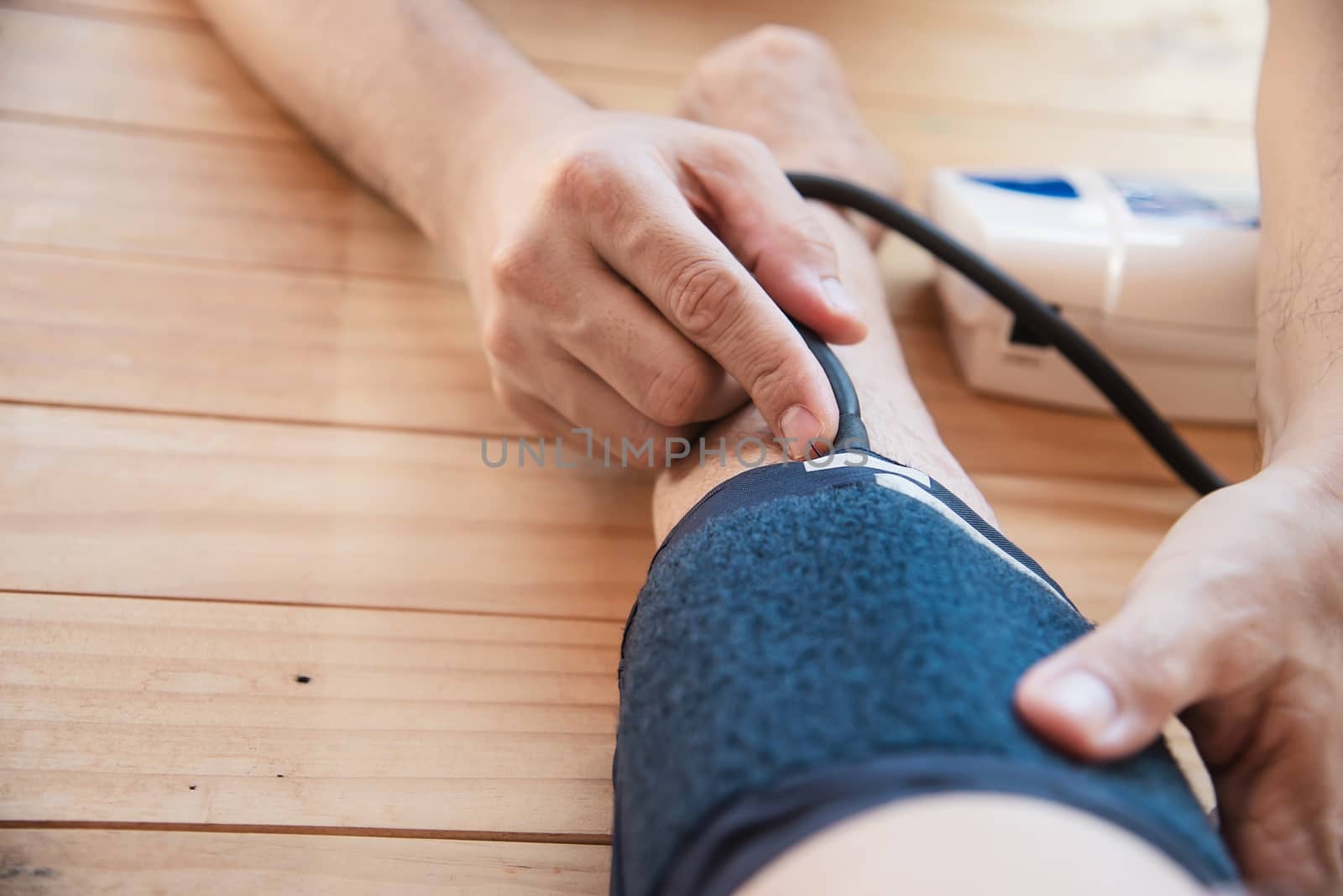 Old lady is being checked blood pressure using blood pressure monitor kid set - people with health care medical instrument set concept