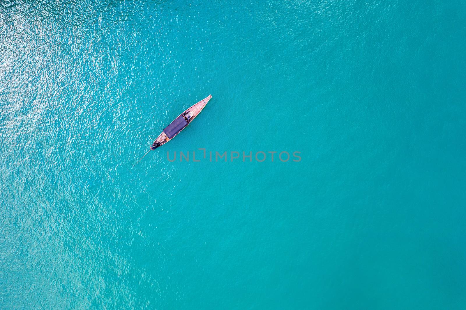 Aerial view of long tail boat on ocean, Thailand. by gutarphotoghaphy