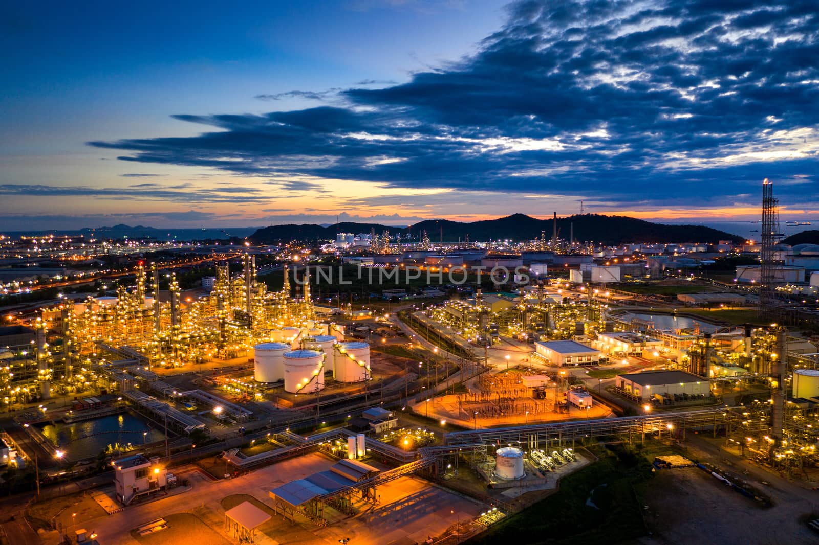 Aerial view of Oil refinery at twilight. by gutarphotoghaphy