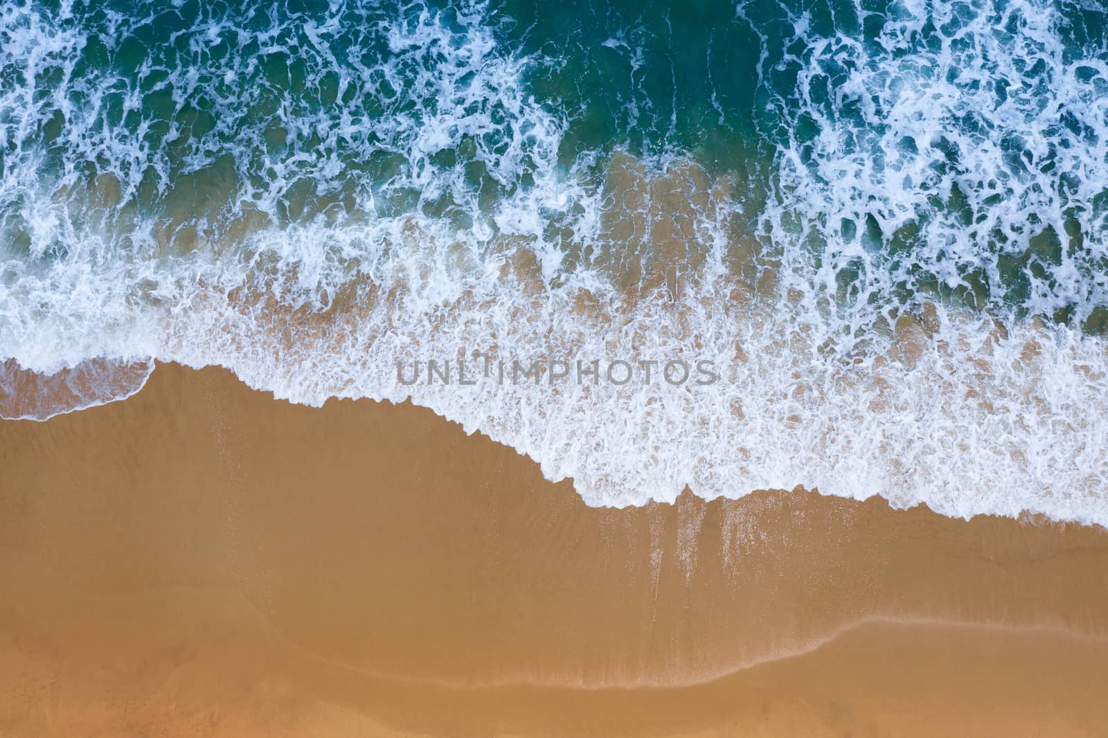 Aerial view of Blue ocean wave on sand beach. by gutarphotoghaphy