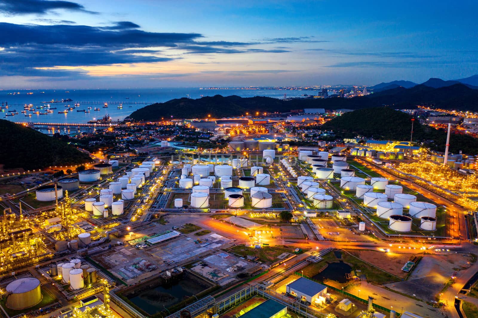 Aerial view of Oil refinery at twilight. by gutarphotoghaphy