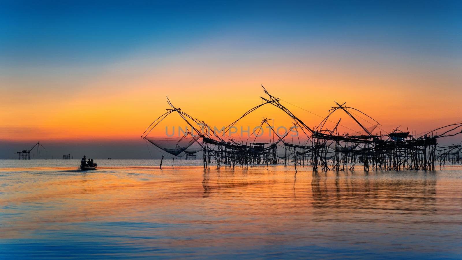 Beautiful sunrise and fishing dip nets at Pakpra in Phatthalung, Thailand. by gutarphotoghaphy