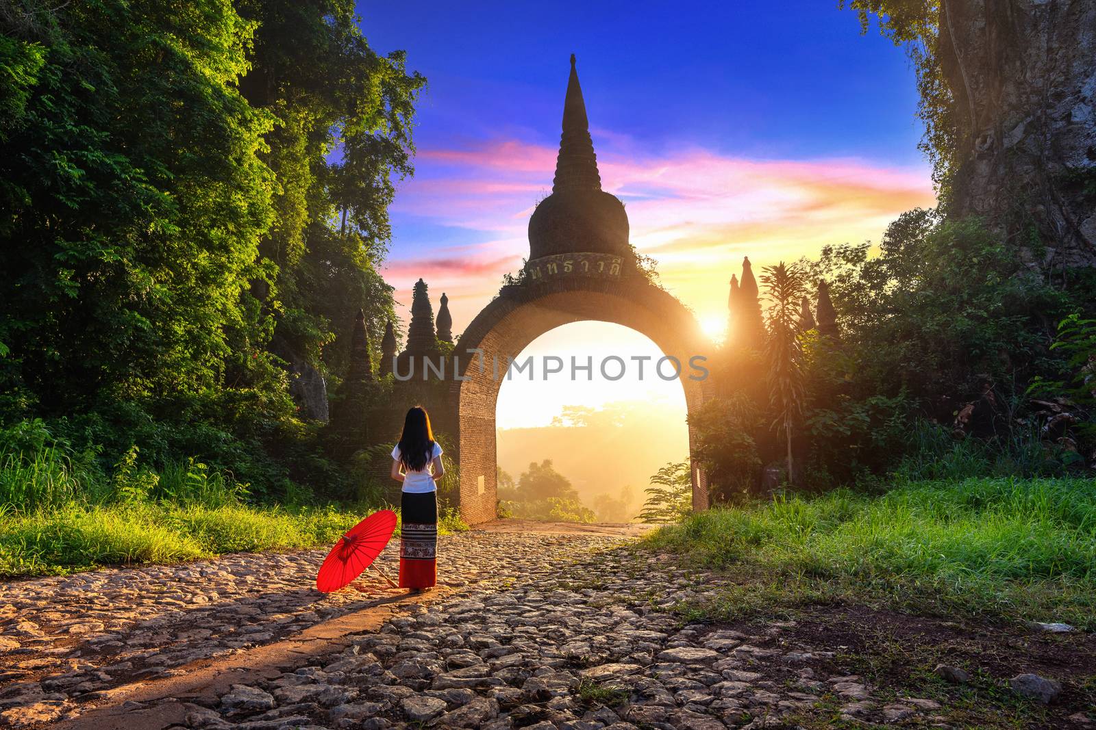 Woman standing at Khao Na Nai Luang Dharma Park in Surat Thani, Thailand by gutarphotoghaphy