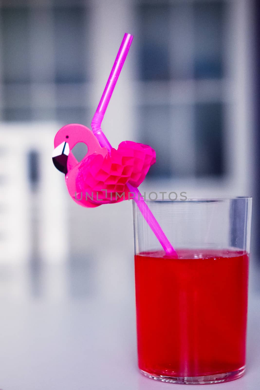 drink red with decorative drinking tube decorated with Flamingo figure by alexandr_sorokin