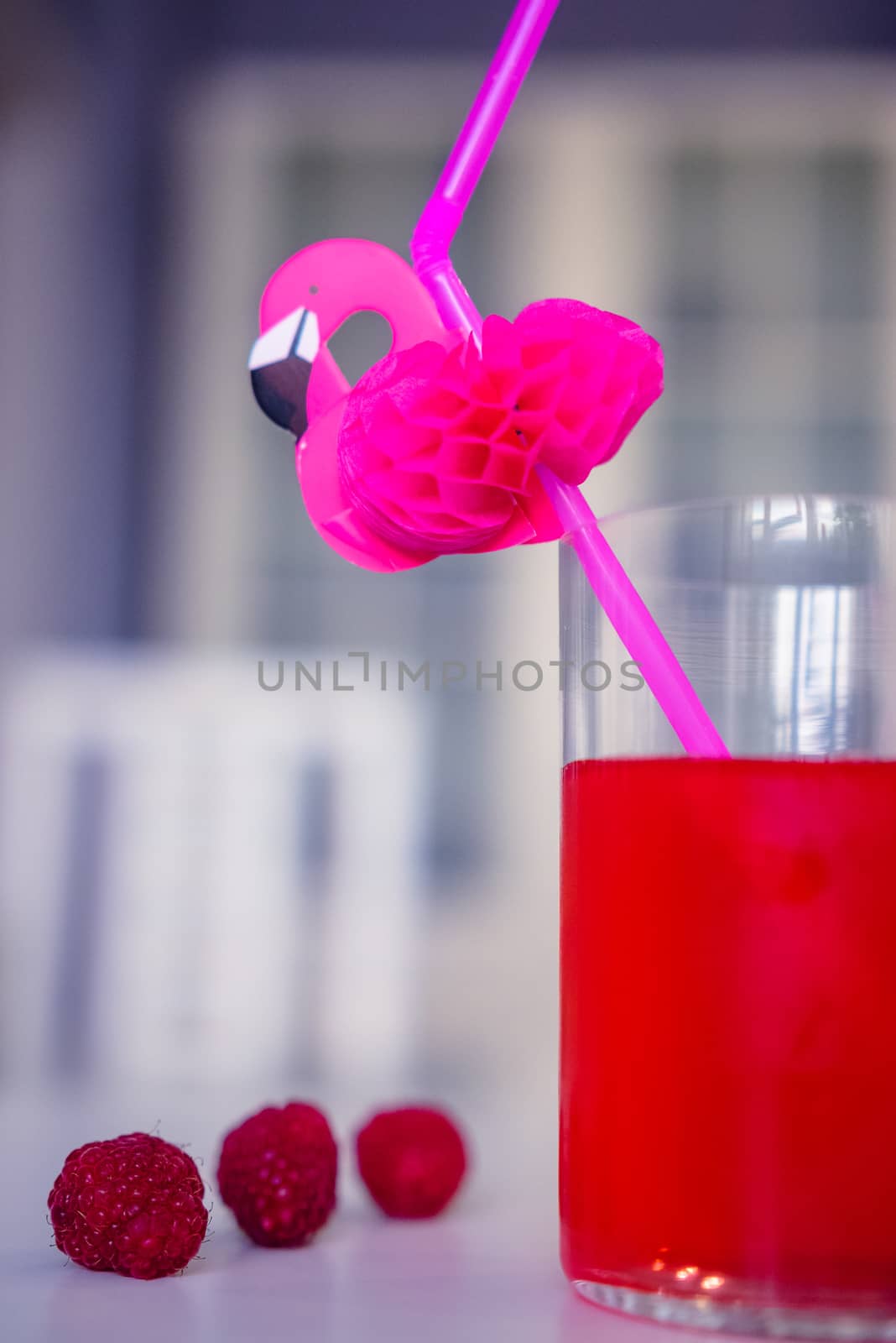 drink red with decorative drinking tube decorated with Flamingo figure