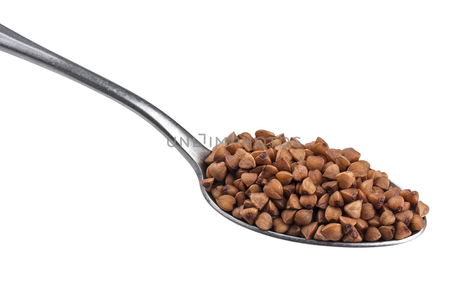 Buckwheat grains in spoon isolated on white background by xamtiw