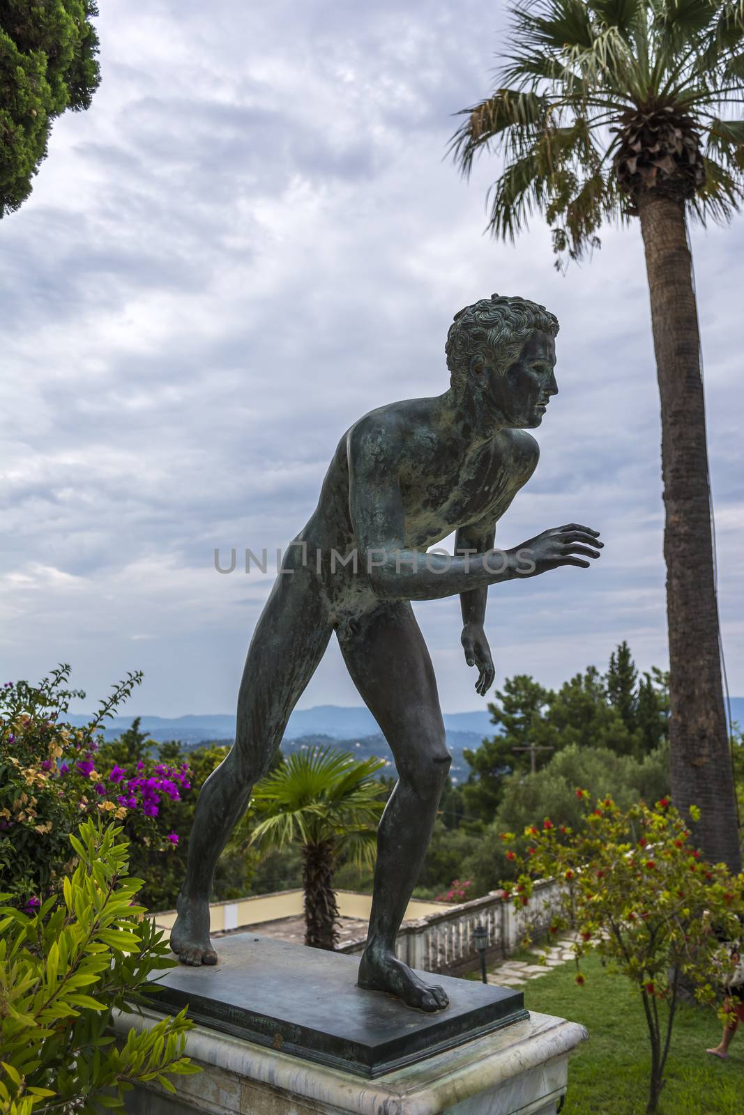 Achilleion palace, Corfu, Greece - August 24, 2018: Bronze runner on Achilleion palace of princess Sissy in Corfu, Greece
