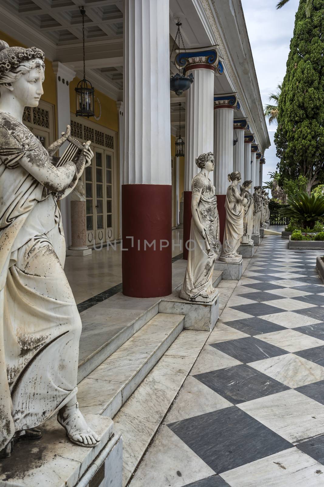 Achilleion palace, Corfu, Greece - August 24, 2018: Statues of the nine muses at Achilleion Palace, island of Corfu. Achilleion was built by Empress Elisabeth of Austria, known as Sissi.