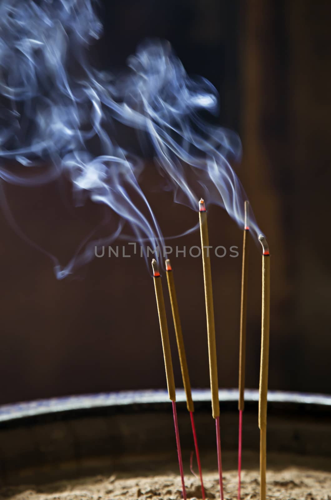 Burning incence sticks in a Buddhist temple