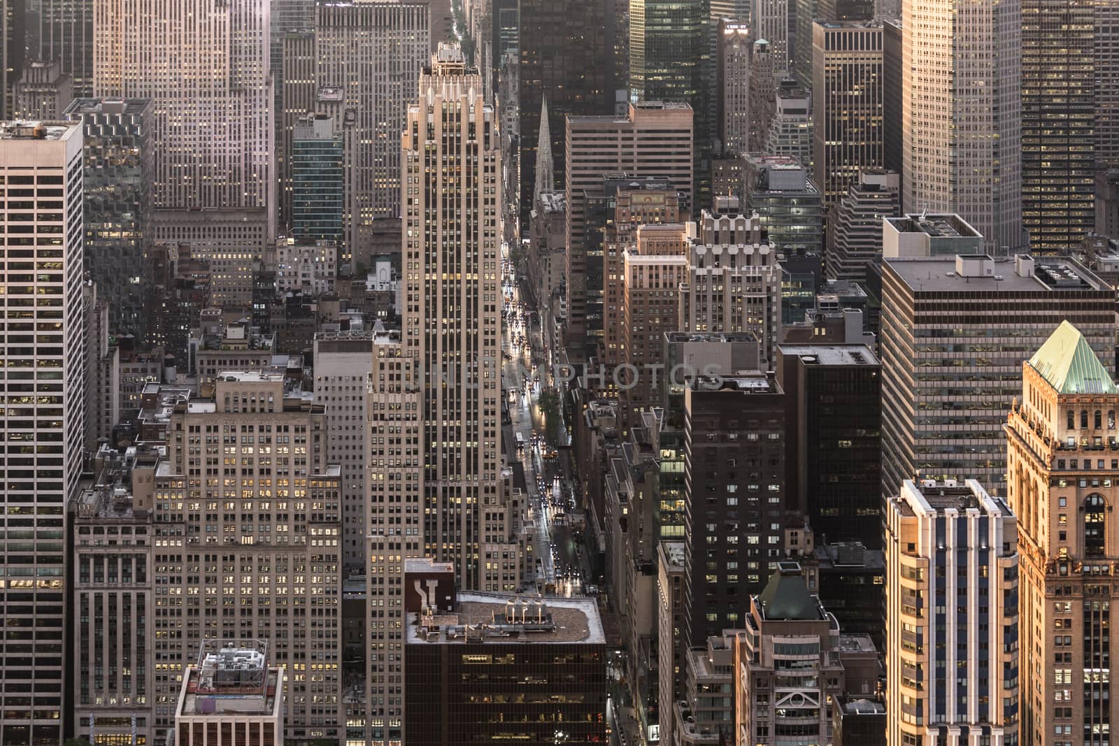 Aerial view of New York City skyline with 5th Avenue at Manhattan midtown. Urban skyscrapers at dramatic after the storm sunset, USA.