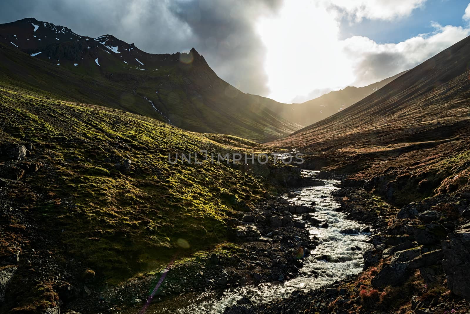 Krossnesfjall mountain and river in backlight on the eastside of Iceland