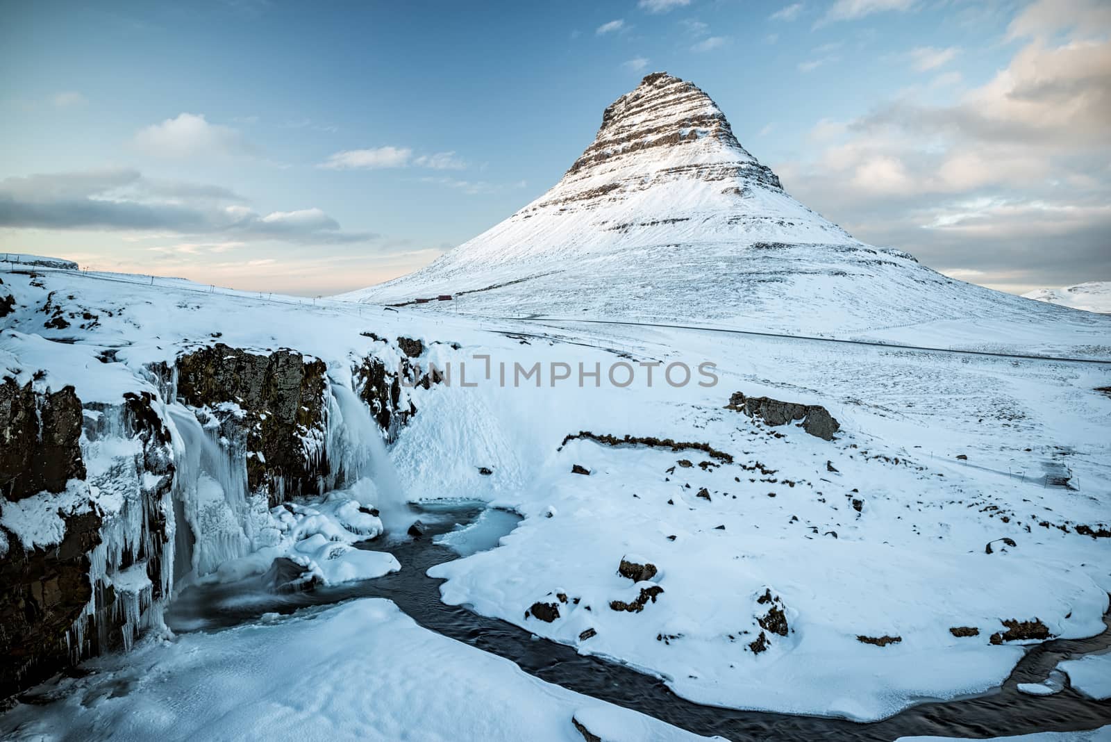 Kirkjufell mountain and waterfall at sunset in Snaefellsnes peninsula, Iceland