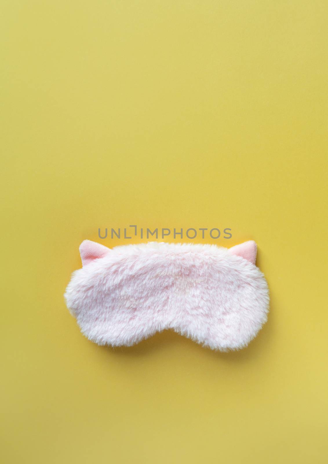 Pastel pink fluffy fur sleep mask with small ears on pastel yell by ALLUNEED