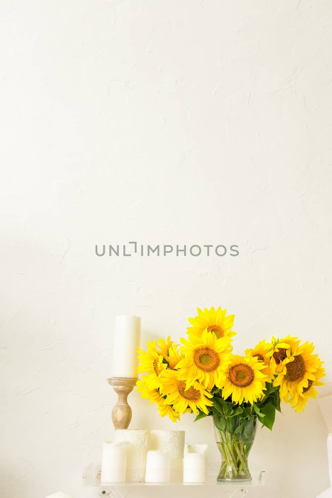 sunflower flowers on the table in a vase in the interior of a bright room