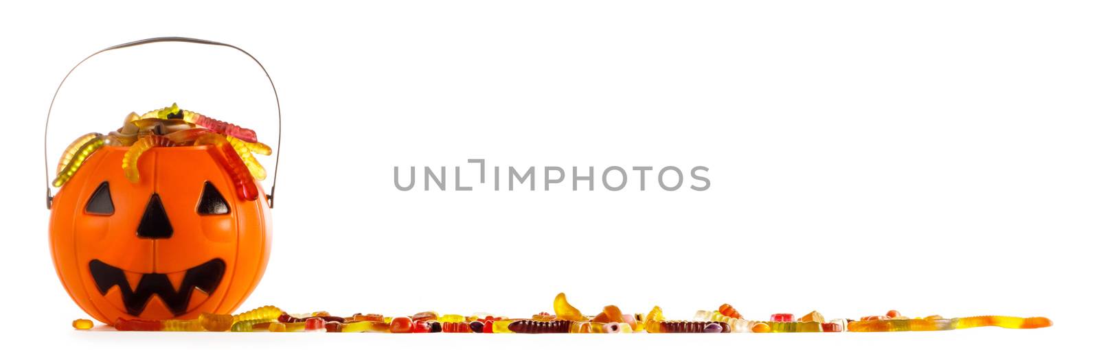 Halloween candies in Jack-O-Lantern bag isolated on white background