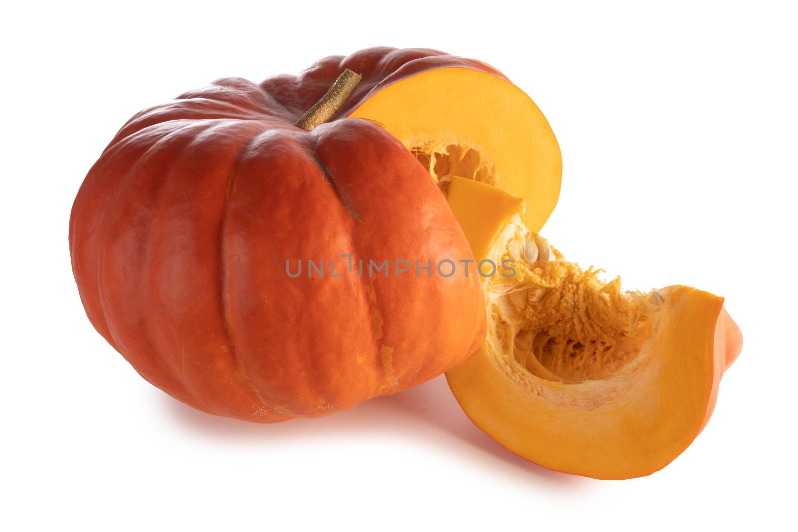 One cut orange pumpkin isolated on white background