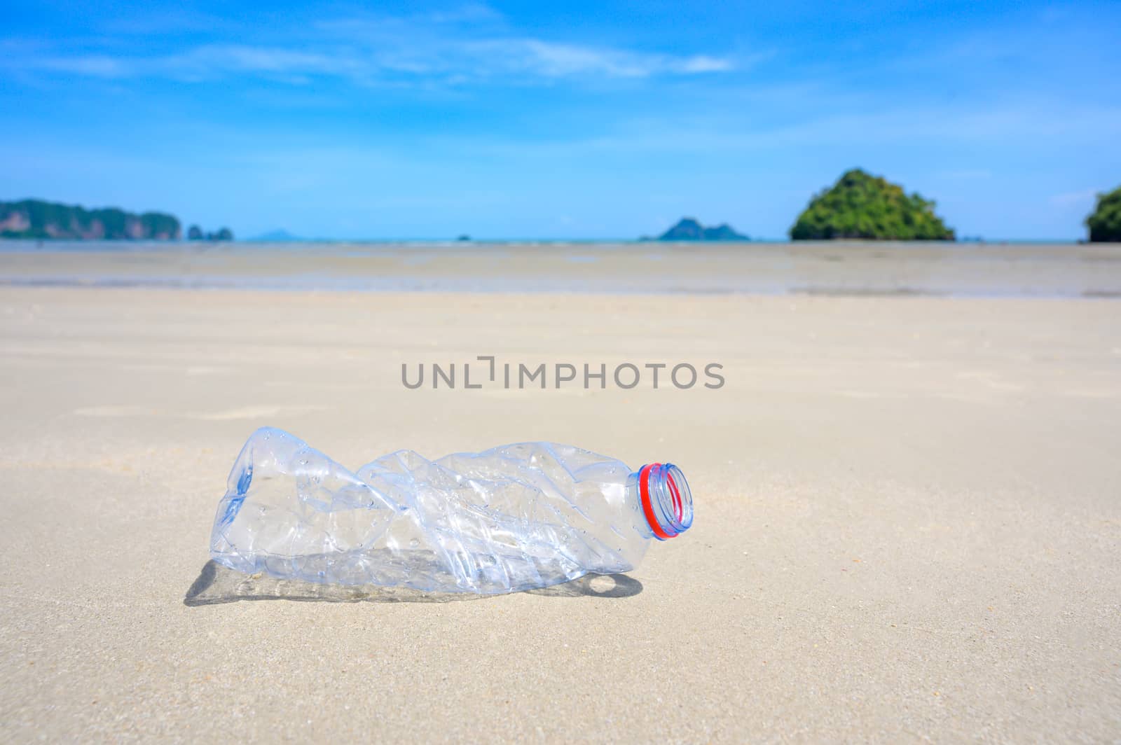 garbage the beach sea plastic bottle lies on the beach and pollutes the sea and the life of marine life Spilled garbage on the beach of the big city. Empty used dirty plastic bottles