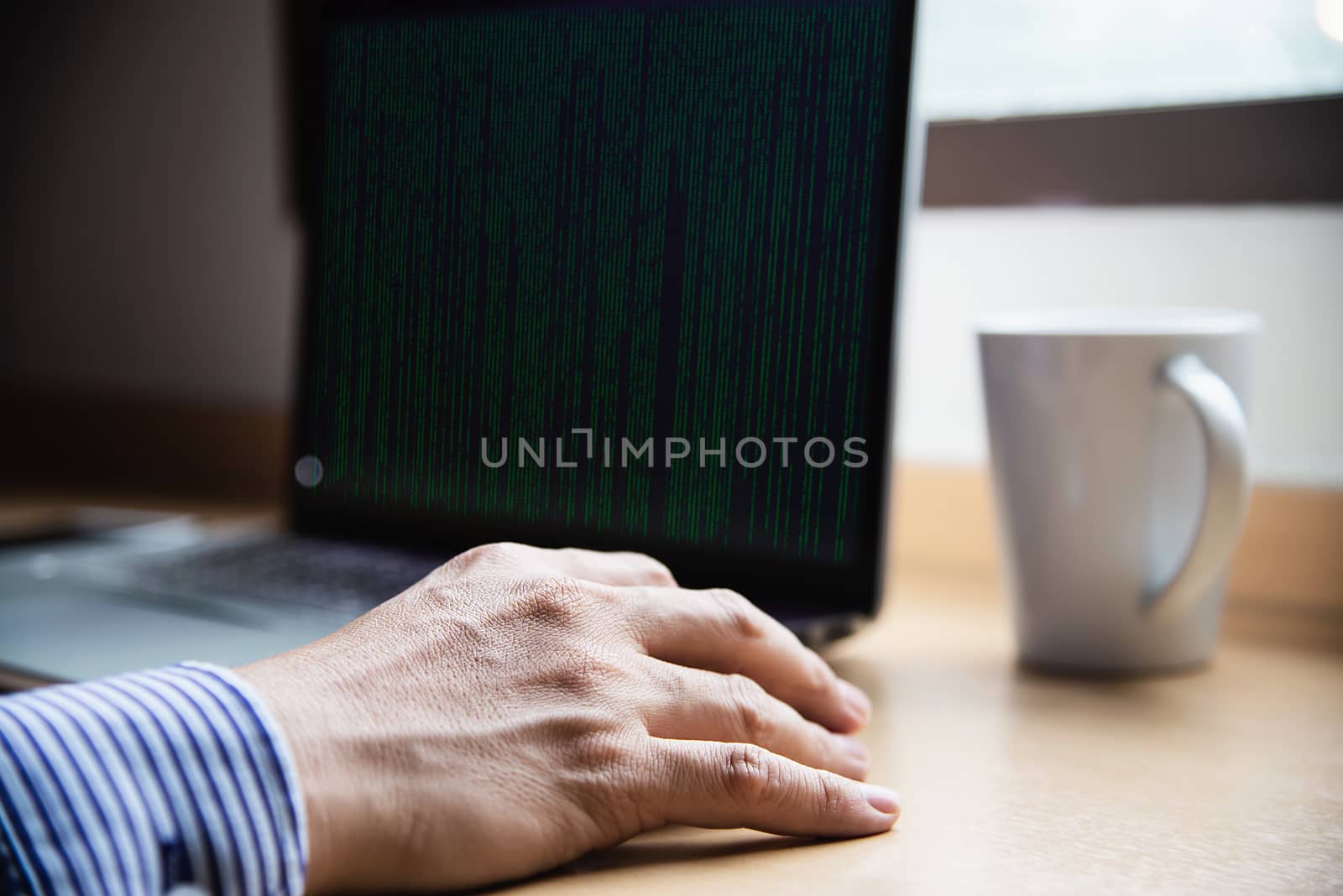 Businessman working with computer with coffee cup in the hotel room - people working lifestyle concept